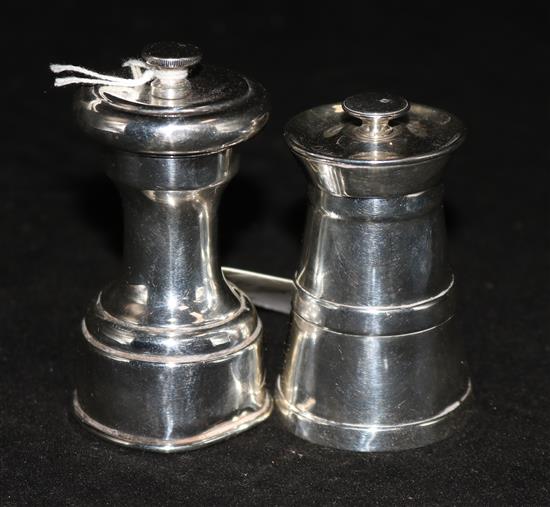 A Hukin & Heath silver pepper grinder, Birmingham, 1927 and one other silver pepper grinder.